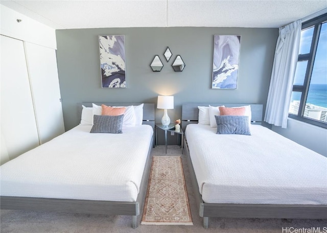 bedroom featuring a closet and a textured ceiling