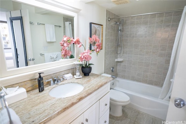 bathroom featuring toilet, shower / bath combo, vanity, and tile patterned flooring