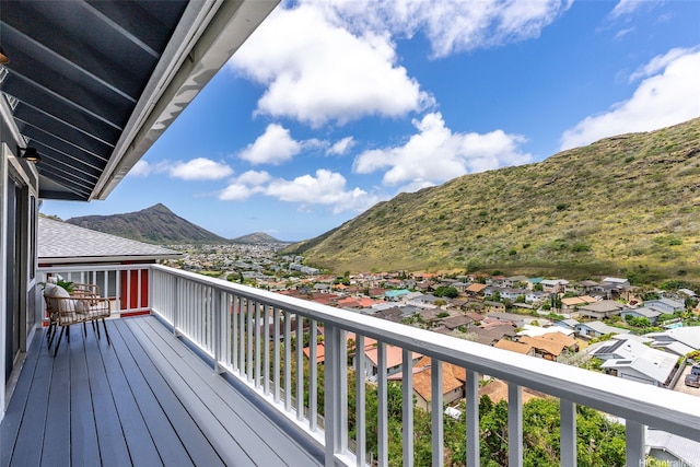 wooden terrace featuring a mountain view and a residential view
