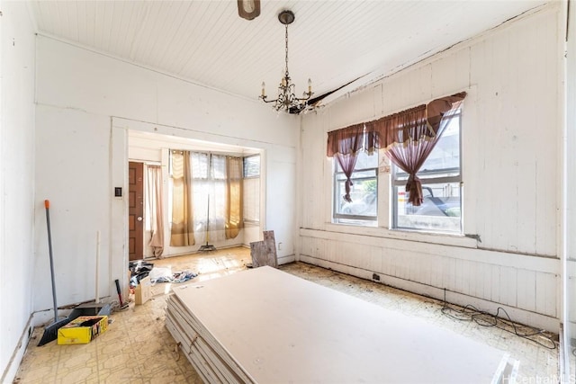 interior space with a chandelier and tile patterned floors