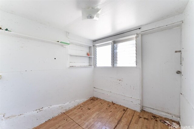 spare room featuring light wood-style floors