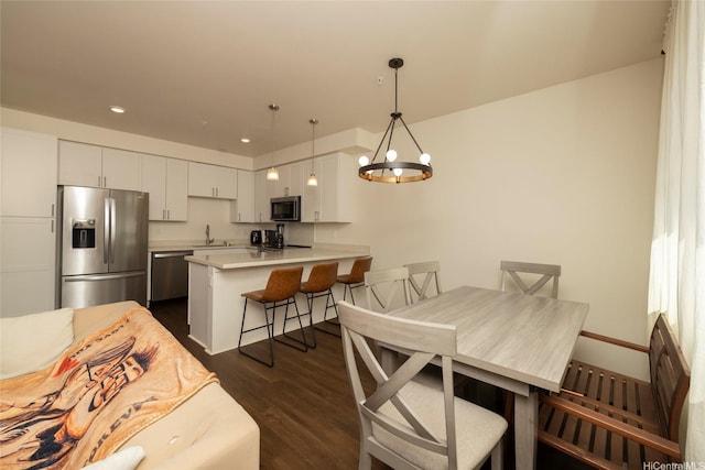 91-3575 Kauluakoko St Unit 1610, Ewa Beach, HI 96706 - dining space featuring a chandelier, dark wood finished floors, and recessed lighting