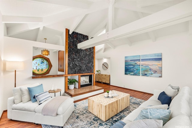 145 Maono Pl, Honolulu, HI 96821 - living area with a fireplace, beamed ceiling, high vaulted ceiling, and wood finished floors
