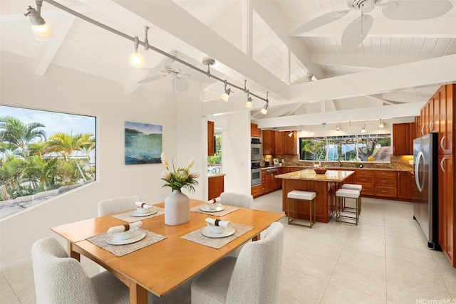145 Maono Pl, Honolulu, HI 96821 - dining space with rail lighting, light tile patterned floors, a ceiling fan, and lofted ceiling with beams