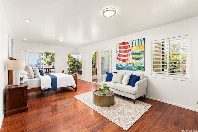 145 Maono Pl, Honolulu, HI 96821 - bedroom featuring wood finished floors, access to outside, baseboards, and multiple windows