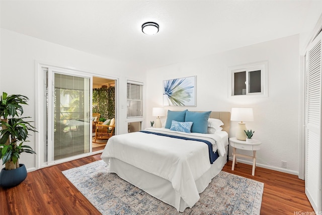 145 Maono Pl, Honolulu, HI 96821 - bedroom featuring access to outside, baseboards, and wood finished floors