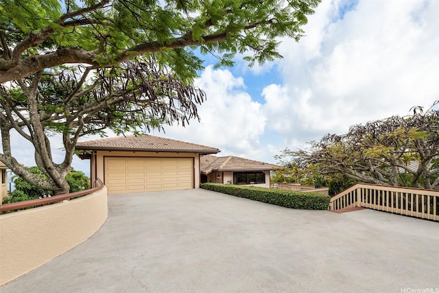 145 Maono Pl, Honolulu, HI 96821 - view of front facade with a tile roof, a garage, and stucco siding