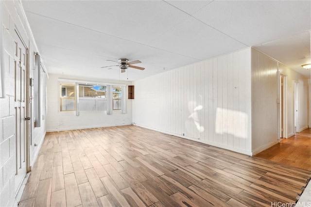 empty room featuring wood finished floors and a ceiling fan