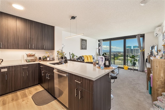615 Keawe St Unit 1905, Honolulu, HI 96813 - kitchen featuring dishwasher, a textured ceiling, a peninsula, light countertops, and a kitchen breakfast bar
