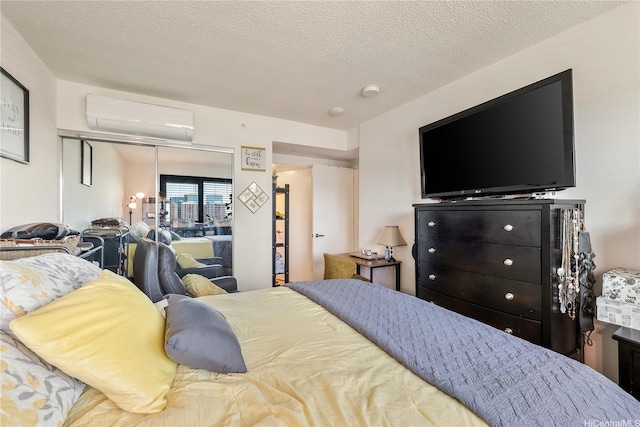 615 Keawe St Unit 1905, Honolulu, HI 96813 - bedroom featuring a wall mounted AC, a closet, and a textured ceiling