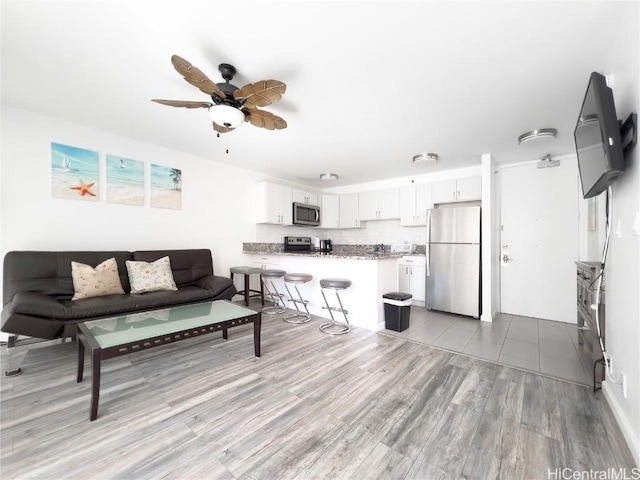 201 Ohua Ave Unit 1108, Honolulu, HI 96815 - living area featuring a ceiling fan and light wood-type flooring