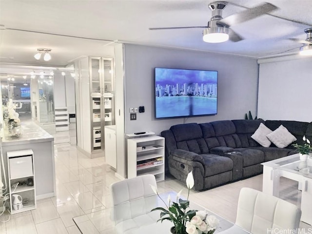 living room with a ceiling fan