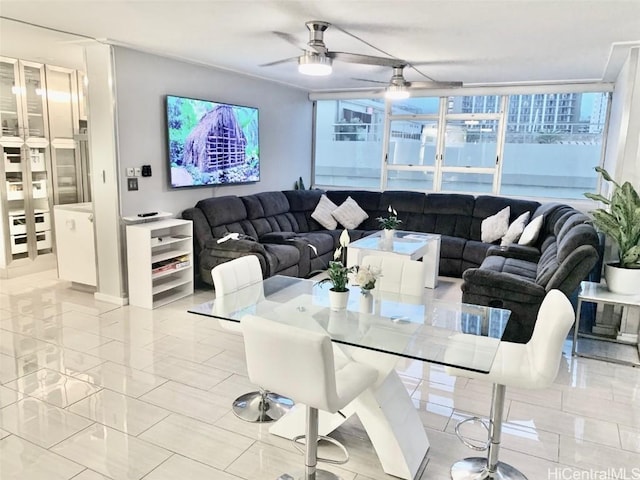 living area featuring a ceiling fan