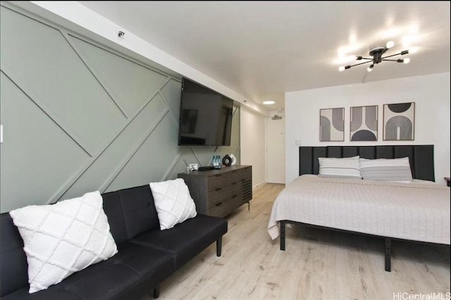 bedroom featuring light wood-style floors