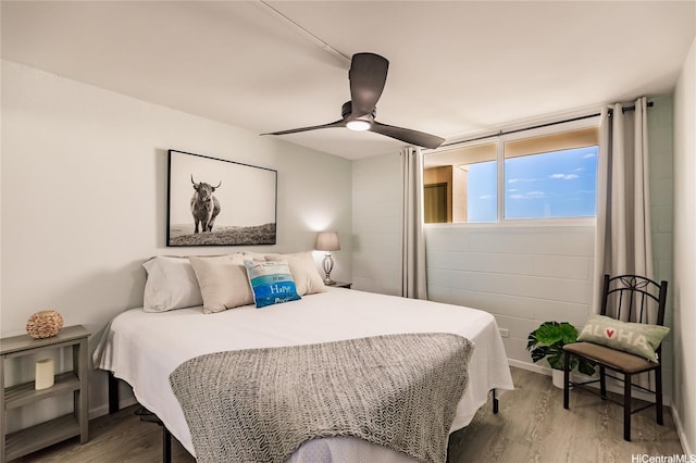 2211 Ala Wai Blvd Unit 3114, Honolulu, HI 96815 - bedroom featuring wood finished floors and a ceiling fan