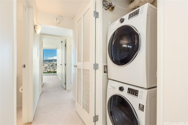1288 Kapiolani Blvd Unit I-4203, Honolulu, HI 96814 - laundry room featuring light carpet, stacked washing maching and dryer, and laundry area