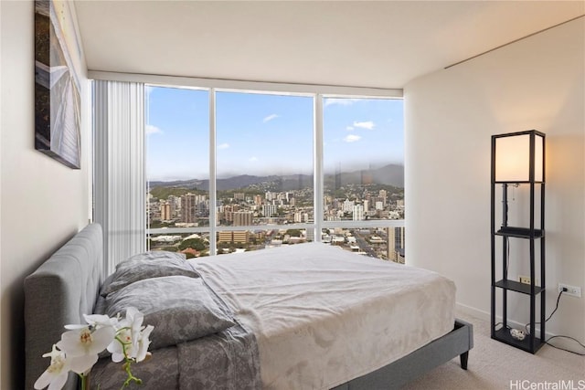 1288 Kapiolani Blvd Unit I-4203, Honolulu, HI 96814 - bedroom featuring a view of city, carpet flooring, a wall of windows, and a mountain view