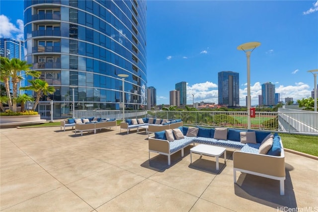 1288 Kapiolani Blvd Unit I-4203, Honolulu, HI 96814 - view of patio featuring an outdoor hangout area, a view of city, and fence