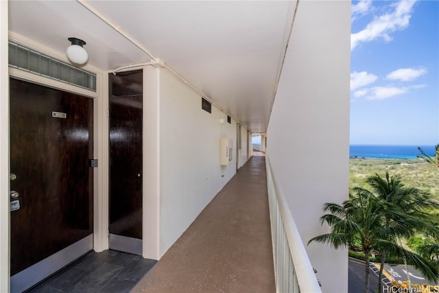 exterior space featuring visible vents and a water view