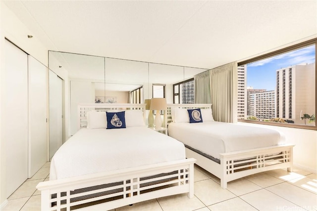 201 Ohua Ave Unit 908, Honolulu, HI 96815 - bedroom featuring light tile patterned floors