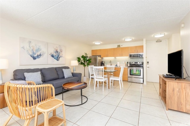 201 Ohua Ave Unit 908, Honolulu, HI 96815 - living area with a textured ceiling and light tile patterned floors