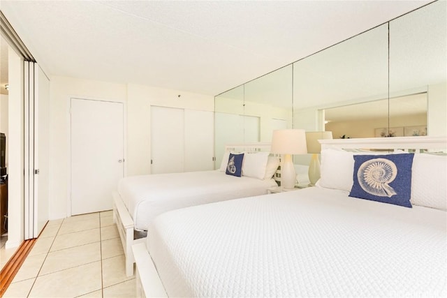 201 Ohua Ave Unit 908, Honolulu, HI 96815 - bedroom featuring a closet and light tile patterned floors
