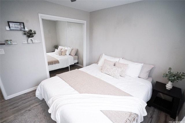 bedroom with baseboards, a closet, and wood finished floors
