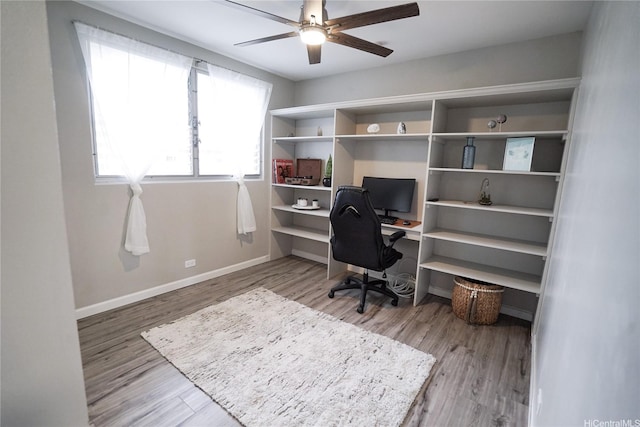 office area featuring ceiling fan, baseboards, and wood finished floors