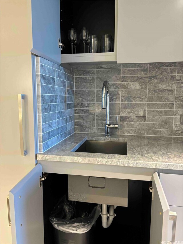 383 Kalaimoku St Unit 1106, Honolulu, HI 96815 - kitchen view of a sink and decorative backsplash