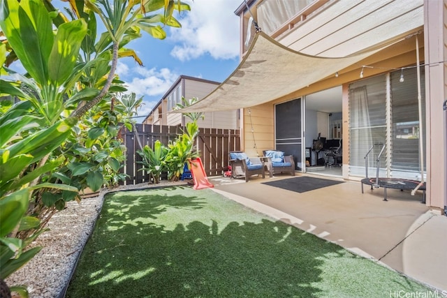 view of yard with a patio and fence