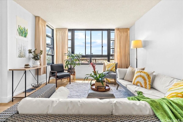750 Kaheka St Unit 702, Honolulu, HI 96814 - living area with baseboards, a textured ceiling, and wood finished floors