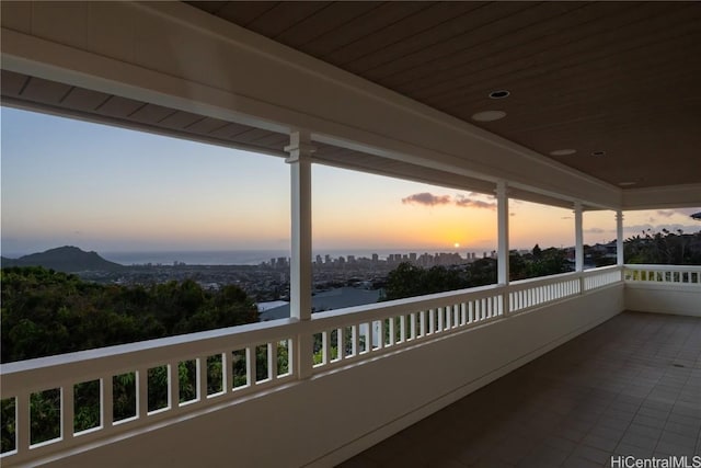 view of balcony at dusk