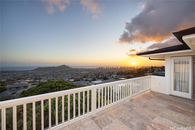 view of balcony at dusk