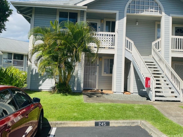 94-203 Paioa Pl Unit P201, Waipahu, HI 96797 - view of building exterior with stairway and uncovered parking