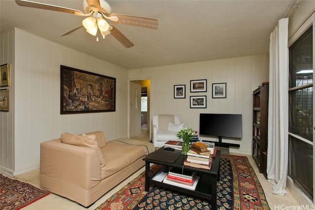 living room with light carpet and a ceiling fan