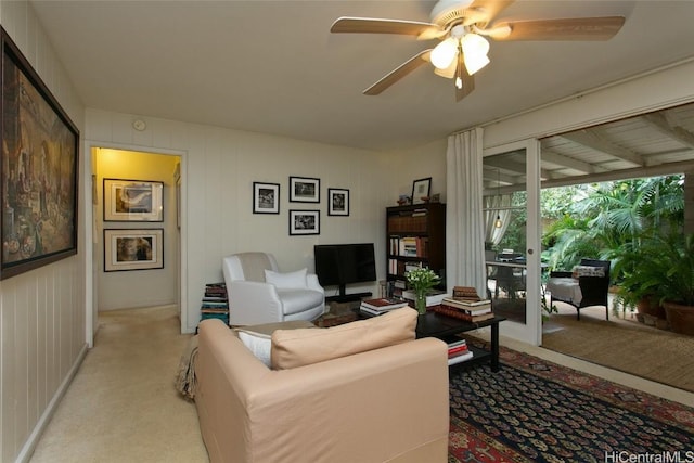 living room featuring light colored carpet and ceiling fan