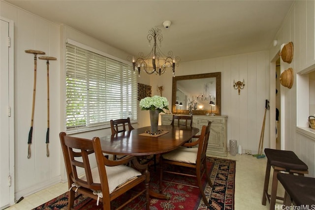 dining space with a notable chandelier and light floors