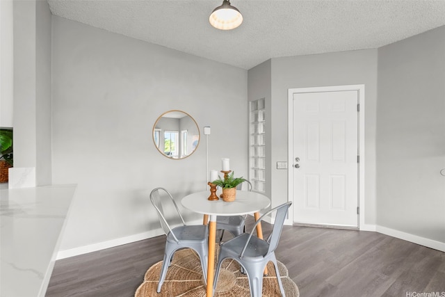 91-293 Hanapouli Cir Unit 3I, Ewa Beach, HI 96706 - dining space featuring wood finished floors and a textured ceiling