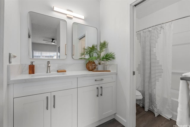 91-293 Hanapouli Cir Unit 3I, Ewa Beach, HI 96706 - full bathroom with double vanity, ceiling fan, wood finished floors, and shower / bathtub combination with curtain