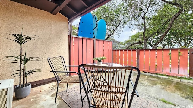 view of patio / terrace featuring fence