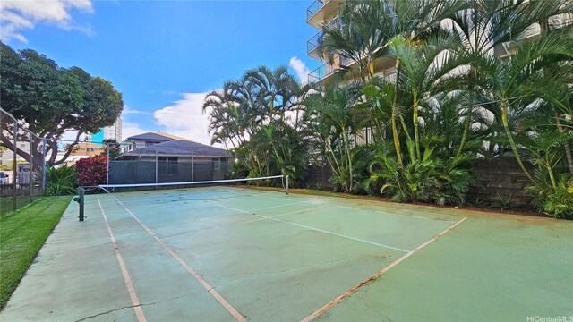 view of sport court featuring fence