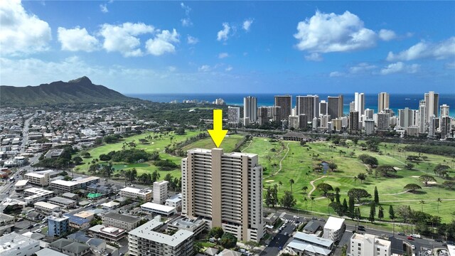 birds eye view of property featuring a water view and a city view
