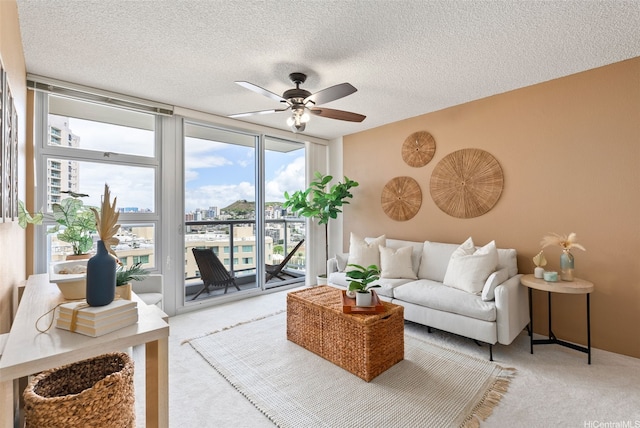 1315 Kalakaua Ave Unit 1903, Honolulu, HI 96826 - carpeted living area with ceiling fan, a textured ceiling, a view of city, and expansive windows