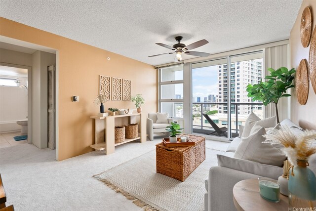 1315 Kalakaua Ave Unit 1903, Honolulu, HI 96826 - carpeted living area featuring a view of city, a ceiling fan, and a textured ceiling