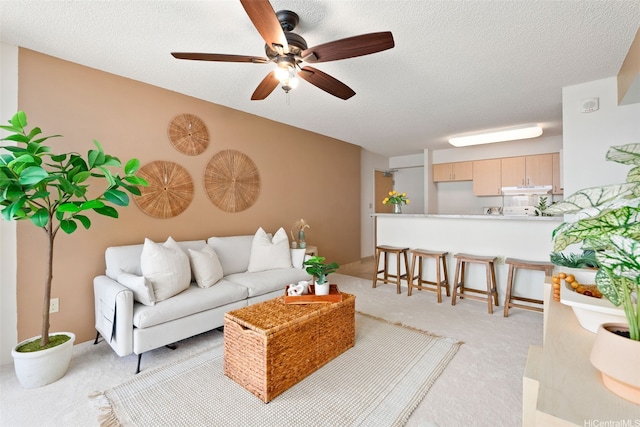1315 Kalakaua Ave Unit 1903, Honolulu, HI 96826 - living area featuring light carpet, ceiling fan, and a textured ceiling