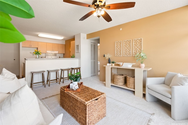 1315 Kalakaua Ave Unit 1903, Honolulu, HI 96826 - living room with light colored carpet, a ceiling fan, and a textured ceiling