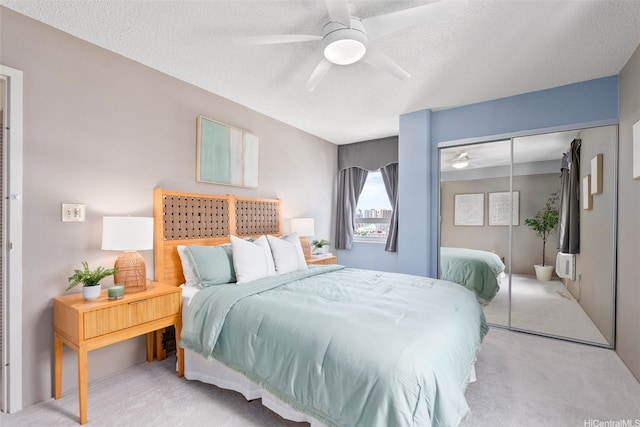 1315 Kalakaua Ave Unit 1903, Honolulu, HI 96826 - bedroom featuring carpet flooring, a closet, a textured ceiling, and a ceiling fan