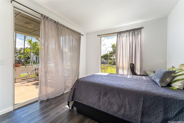 91-1058 Kekuilani Loop Unit 1701, Kapolei, HI 96707 - bedroom with multiple windows, access to outside, and wood finished floors