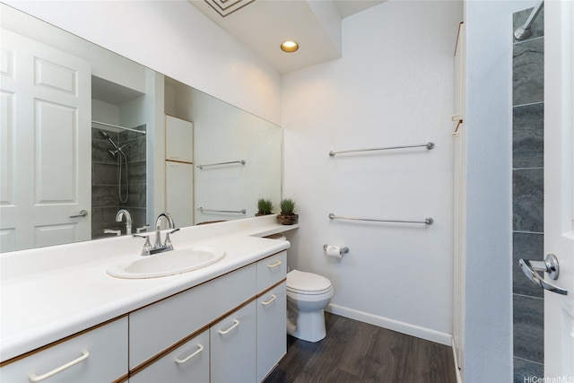91-1058 Kekuilani Loop Unit 1701, Kapolei, HI 96707 - bathroom featuring vanity, toilet, baseboards, walk in shower, and wood finished floors