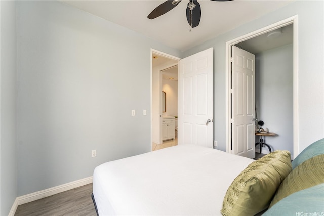 91-1058 Kekuilani Loop Unit 1701, Kapolei, HI 96707 - bedroom with baseboards, a ceiling fan, and light wood-style flooring
